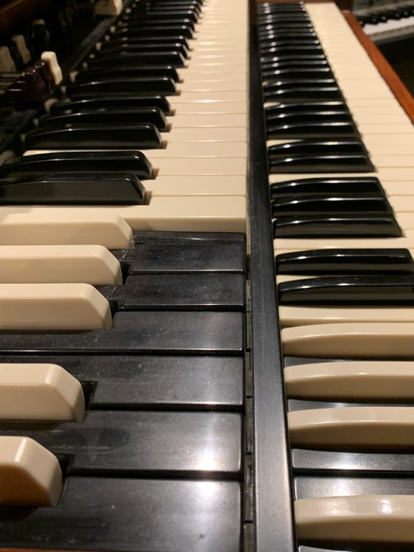 Music studio with vintage keyboards and synthesizers